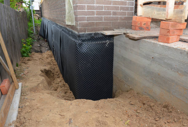 SJ Waterproofing Pros technician performing targeted Interior Drainage System assessment in Birch Run, MI